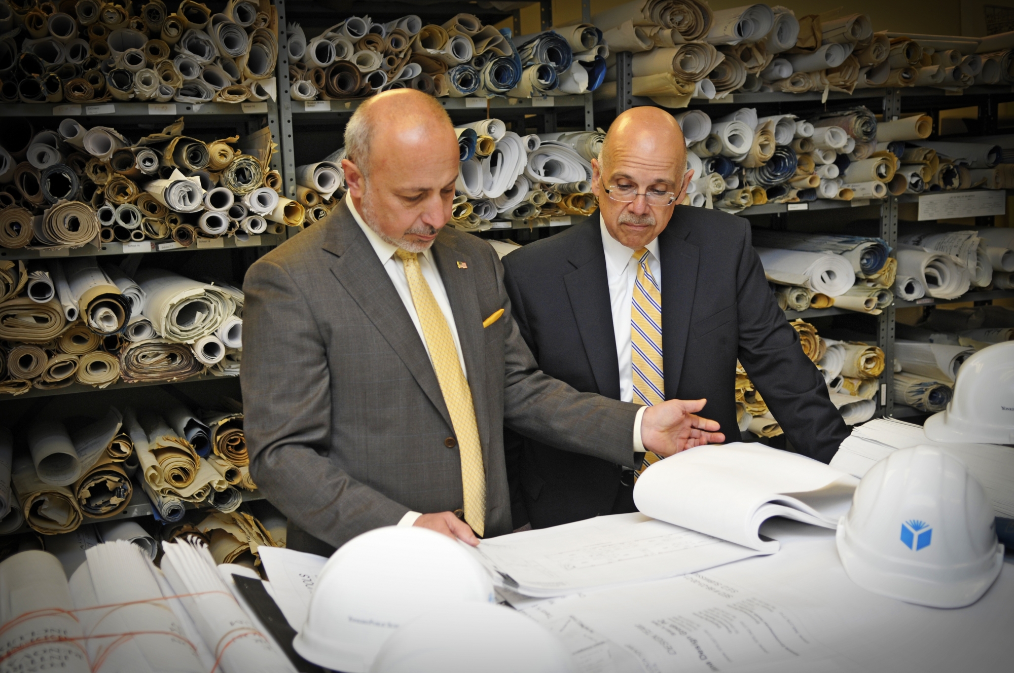 Yonkers Superintendent of Schools Bernard P. Pierorazio (left) and Chief Administrative Officer Joseph Bracchitta (right) review plans to revitalize the district's aging infrastructure.